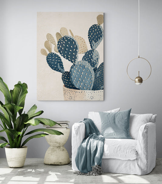 pièce de vie, fauteuil blanc, coussin et plaid vert, table d'appoint moderne, grande plante verte, poster cactus, lumière en suspension.
