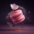 Tableau de deux macarons roses flottant dans une explosion de saveurs, avec du sucre en poudre et du pollen doré autour. Une fleur de sakura ajoute une touche fleurie à cette gourmandise artisanale. Le focus est sur les formes douces des macarons et l'énergie de l'explosion en arrière-plan.